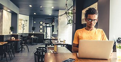 Man using a laptop serious look