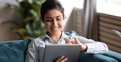 Young woman using a laptop phone