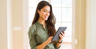 Young woman using a laptop phone